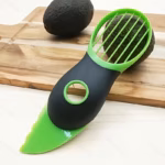 Avocado Slicer and Pitter for Separating and Removing Fruit Cores – black/green variant image 1